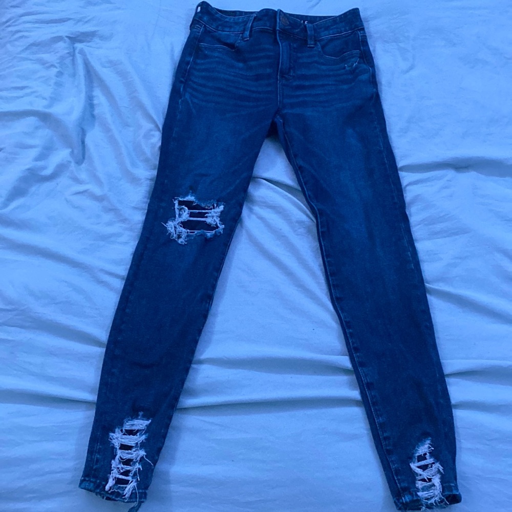 patched ripped dark wash skinny jeans